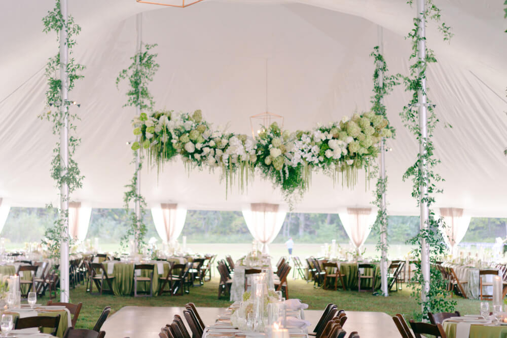 wedding tent chandelier and florals